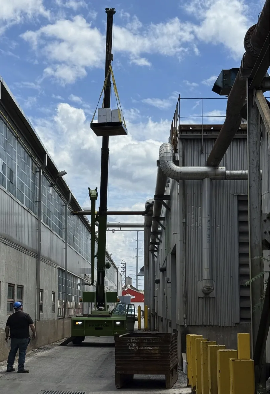 Crane lifting an air filter housing during what started as a simple filter element change