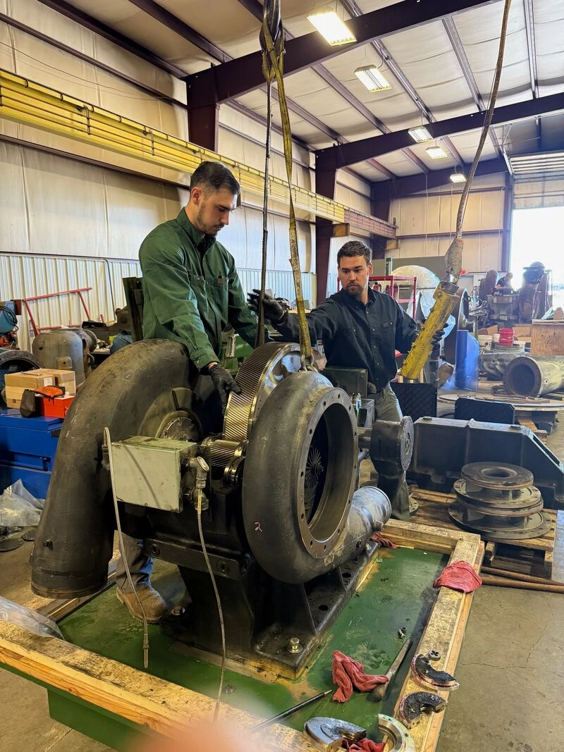 The Fischer Group technicians collecting vibration data from industrial equipment